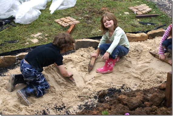 kids flatening the sand