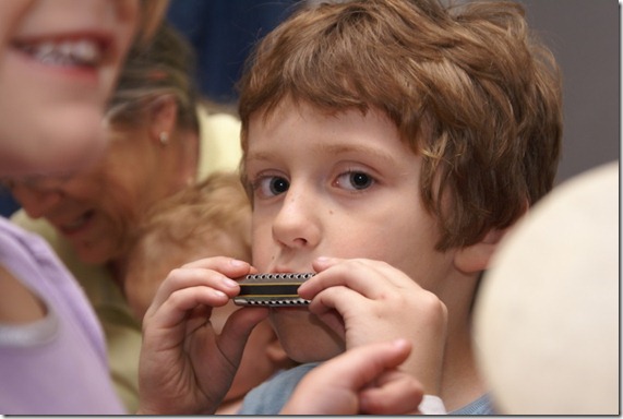 Eli with a harmonica