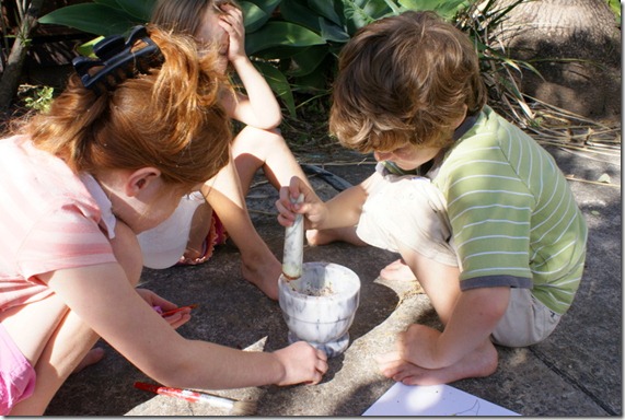 kids smashing stones