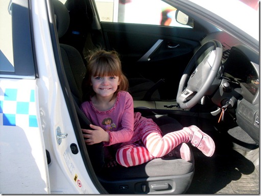 Lilly in the police car